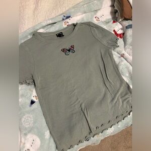 Butterfly, sage green top.